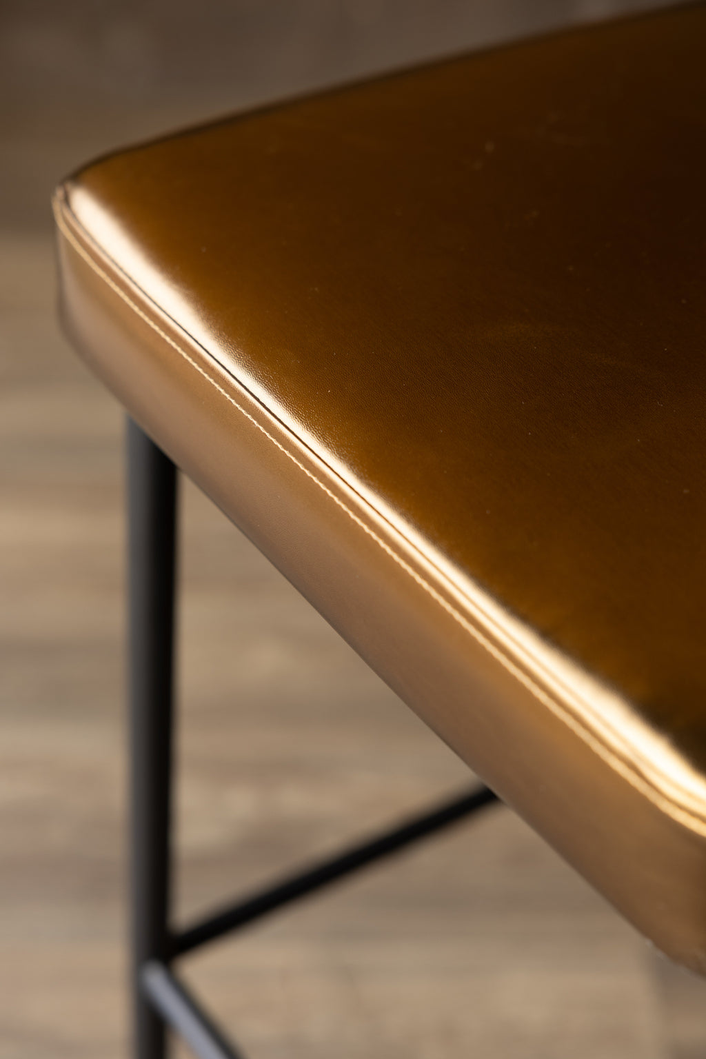 Burnished Gold Roll Back Bar Stool