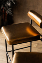 Burnished Gold Roll Back Bar Stool
