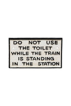 Do Not Use The Toilet When The Train... Hanging Sign